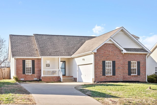 view of front of home featuring a front yard and a garage