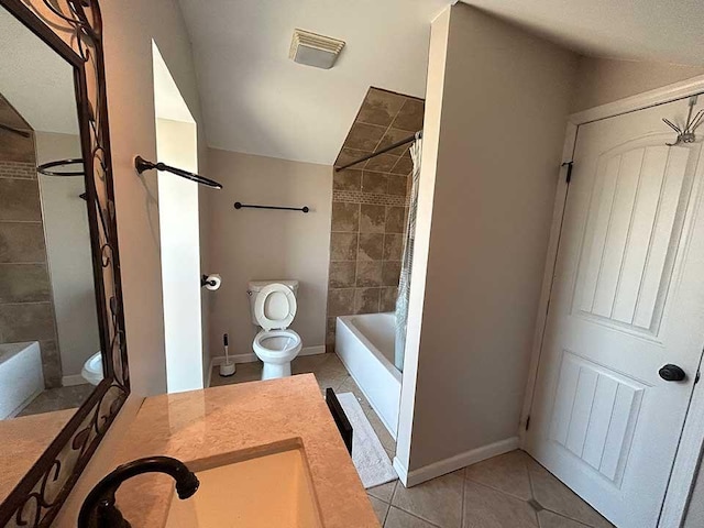 full bathroom with toilet, tile patterned flooring, tiled shower / bath, and vanity