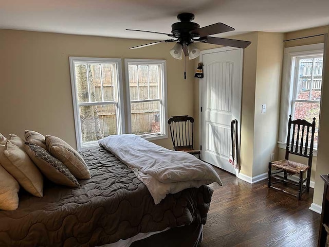 bedroom featuring ceiling fan and dark hardwood / wood-style floors