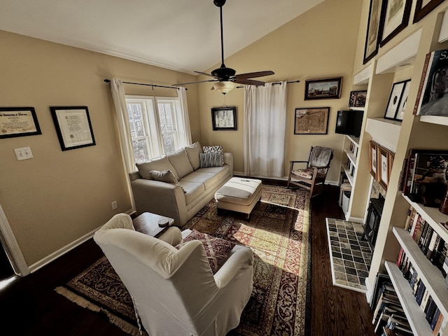 living room with a fireplace, ceiling fan, vaulted ceiling, and dark wood-type flooring