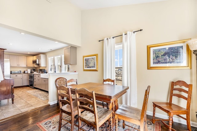 dining space with baseboards, recessed lighting, and light wood-style floors