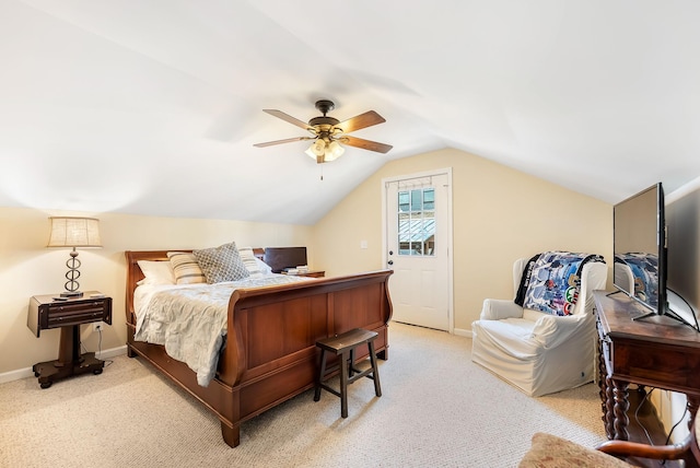 bedroom with light carpet, baseboards, vaulted ceiling, and a ceiling fan