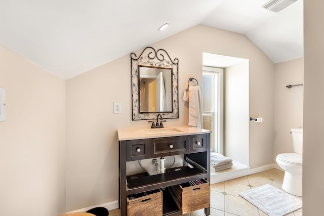 bathroom featuring baseboards, visible vents, toilet, tile patterned floors, and vaulted ceiling