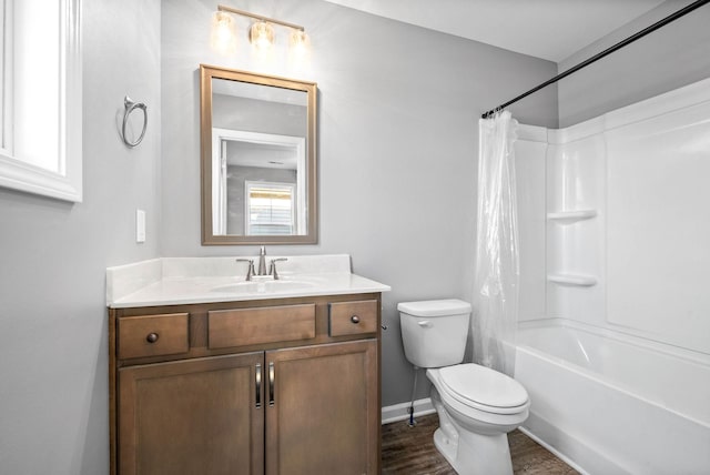 full bathroom featuring shower / bath combo, hardwood / wood-style floors, vanity, and toilet