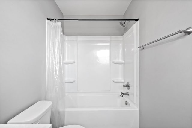 bathroom with toilet and shower / bath combination with curtain