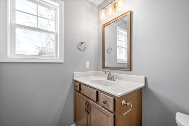 bathroom featuring toilet and vanity