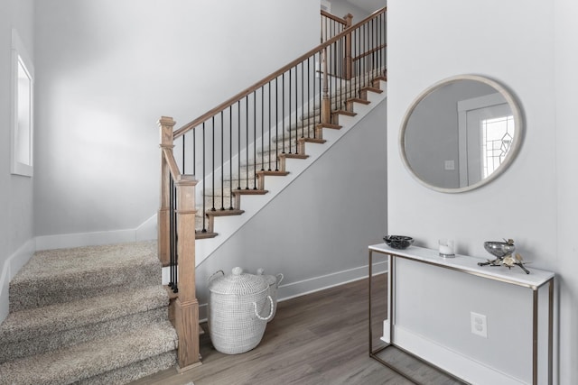 staircase with wood-type flooring