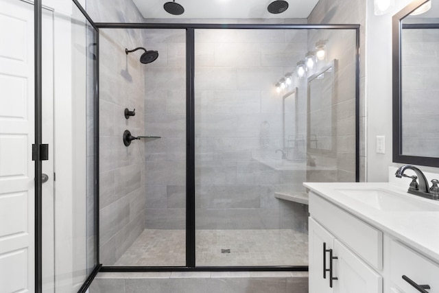 bathroom with an enclosed shower and vanity