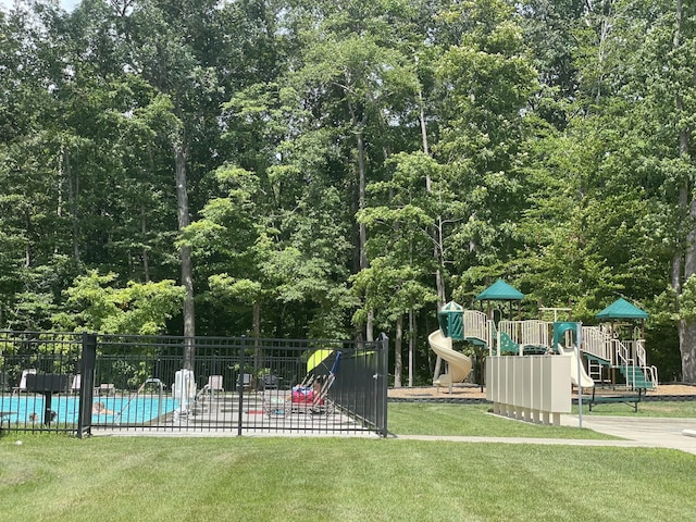 surrounding community with a yard, a playground, and a pool