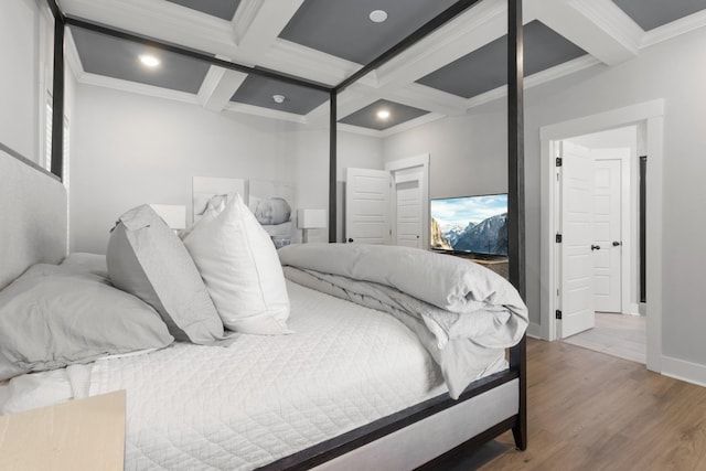 bedroom featuring hardwood / wood-style floors, coffered ceiling, crown molding, and beamed ceiling