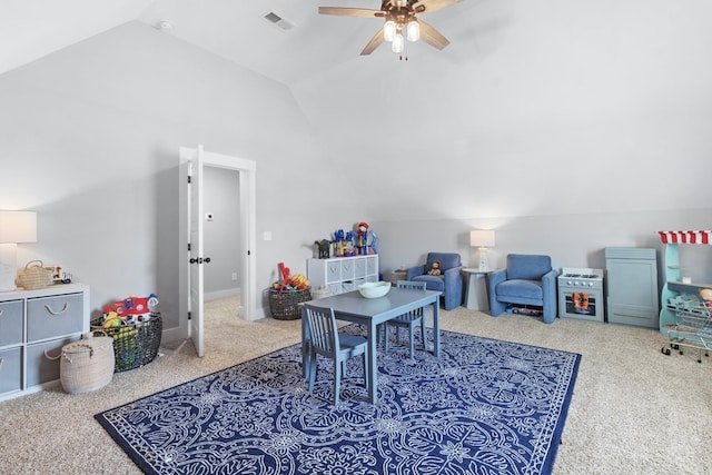 rec room featuring ceiling fan, lofted ceiling, and carpet flooring