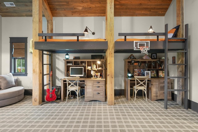 interior space with wooden ceiling, high vaulted ceiling, and carpet