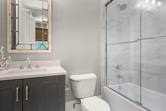 full bathroom with toilet, shower / bath combination with glass door, and vanity