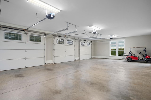 garage featuring a garage door opener