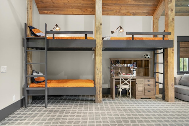 carpeted bedroom with wood ceiling and lofted ceiling