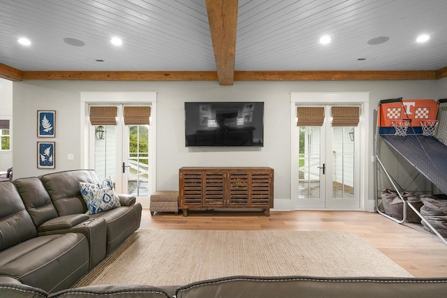 living room with beamed ceiling, french doors, wood ceiling, and hardwood / wood-style floors