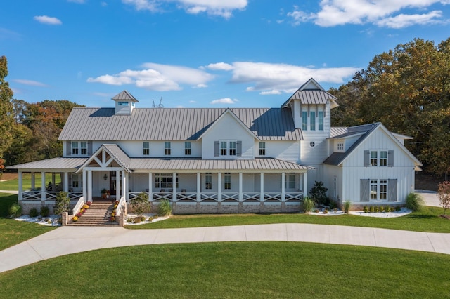 view of front facade with a front yard and a porch