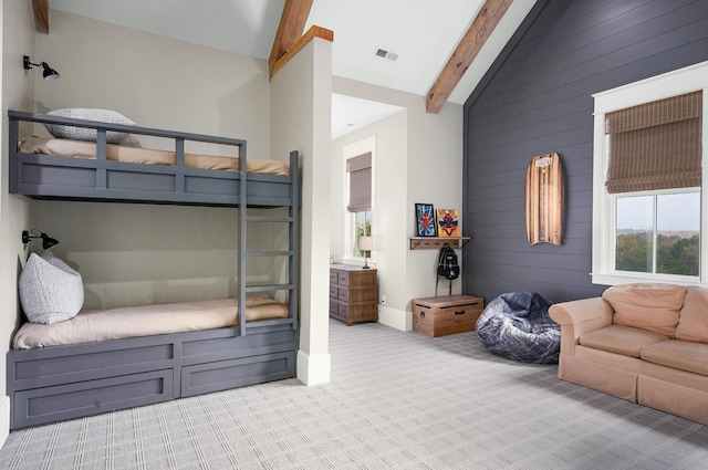 carpeted bedroom featuring high vaulted ceiling and beamed ceiling