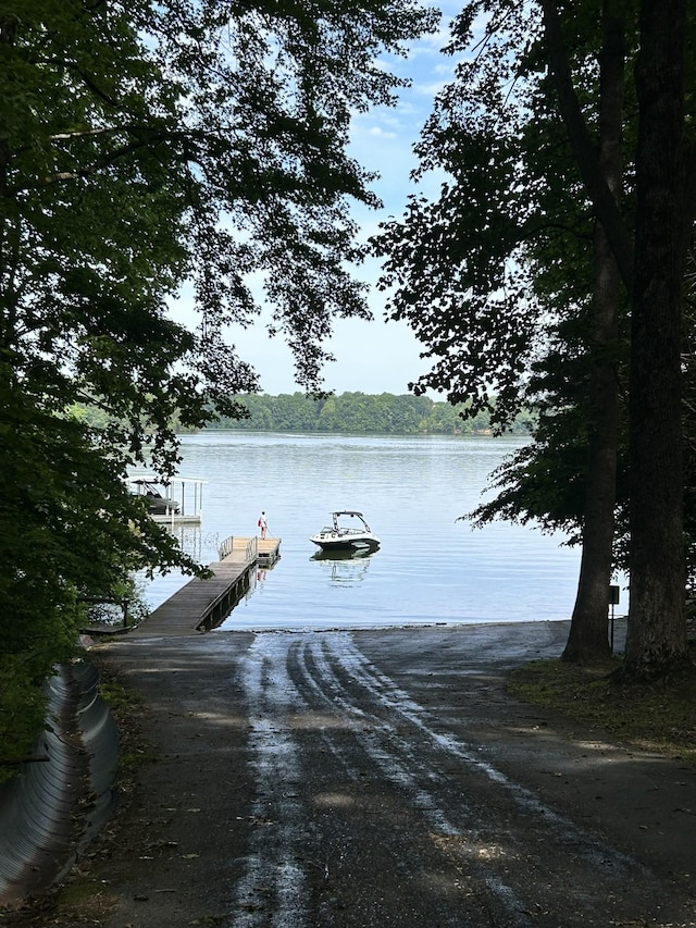 property view of water featuring a boat dock