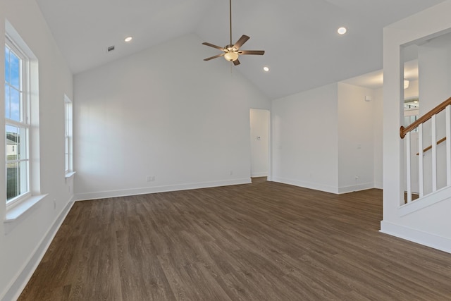 unfurnished living room with ceiling fan, dark hardwood / wood-style floors, and high vaulted ceiling