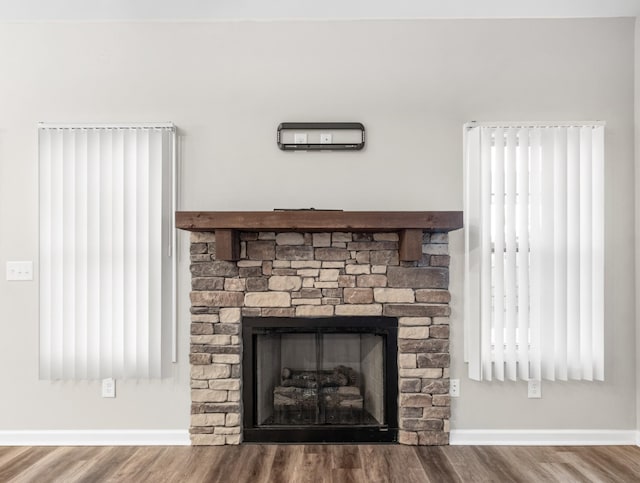 room details with hardwood / wood-style floors and a fireplace