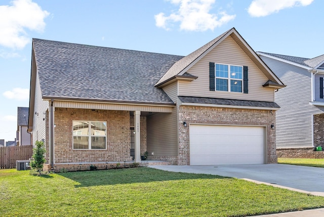 front of property with a garage, cooling unit, and a front lawn