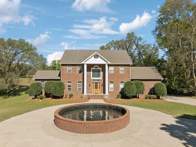 neoclassical / greek revival house with a front yard