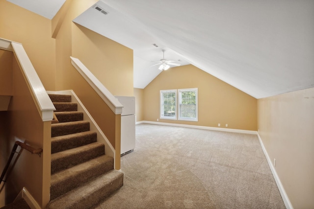 bonus room featuring vaulted ceiling, light colored carpet, and ceiling fan