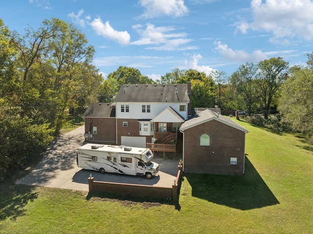 rear view of property featuring a yard