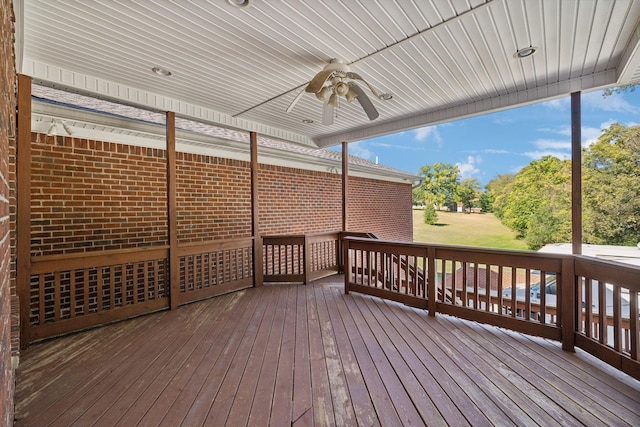 wooden terrace featuring ceiling fan