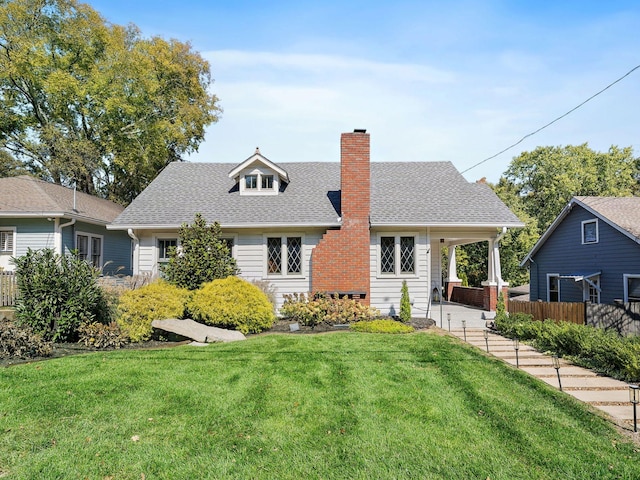 view of front of house featuring a front yard and a patio