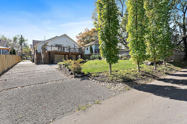 view of front facade featuring a front yard and a garage