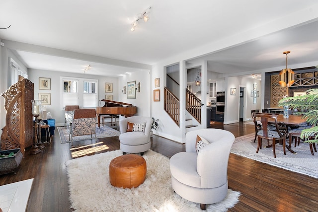 living room with dark hardwood / wood-style flooring