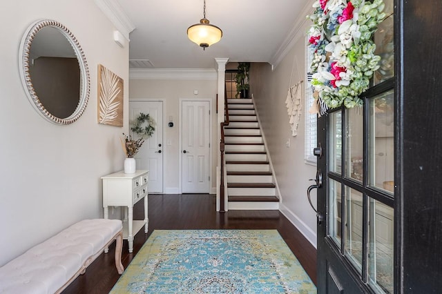 entryway featuring crown molding and dark hardwood / wood-style flooring