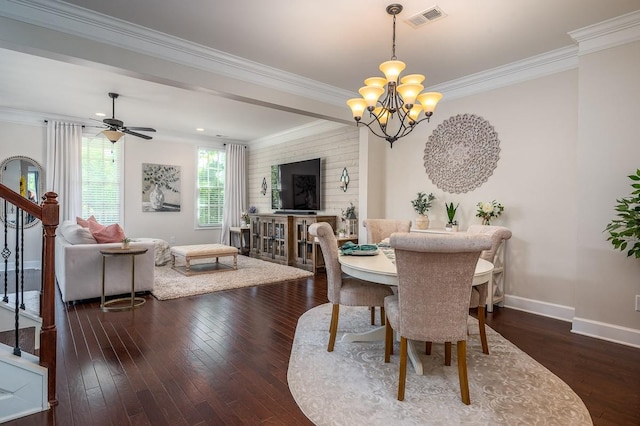 dining area with ceiling fan with notable chandelier, dark wood-type flooring, and crown molding