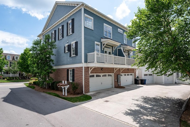 view of front of home featuring a balcony and a garage