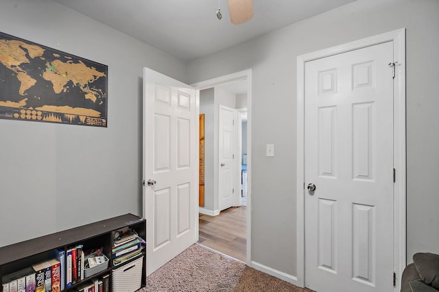 interior space featuring ceiling fan