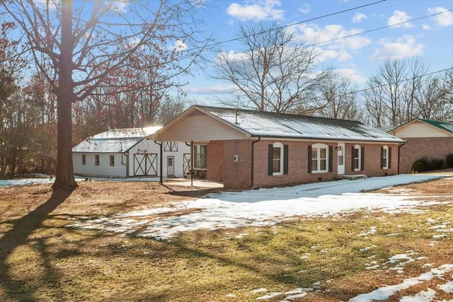 view of snow covered house