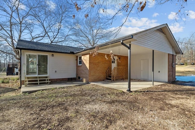 back of property with a patio area