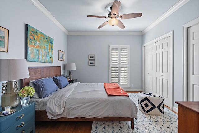 bedroom with a closet, ceiling fan, crown molding, and dark hardwood / wood-style flooring