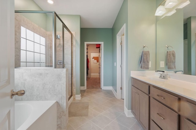 bathroom featuring vanity, tile patterned floors, and independent shower and bath