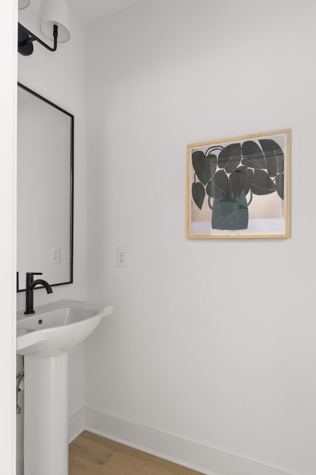 bathroom featuring sink and hardwood / wood-style flooring