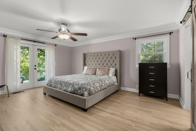 bedroom with ceiling fan, ornamental molding, multiple windows, and access to exterior