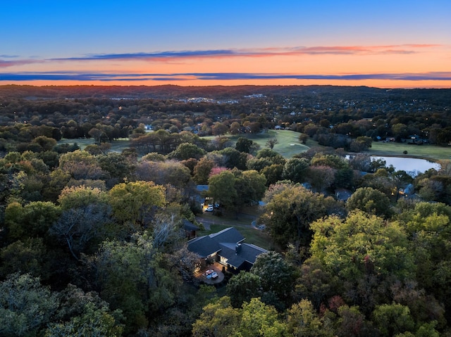 aerial view at dusk with a water view