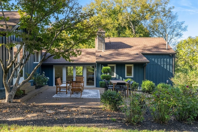 back of property with a patio area