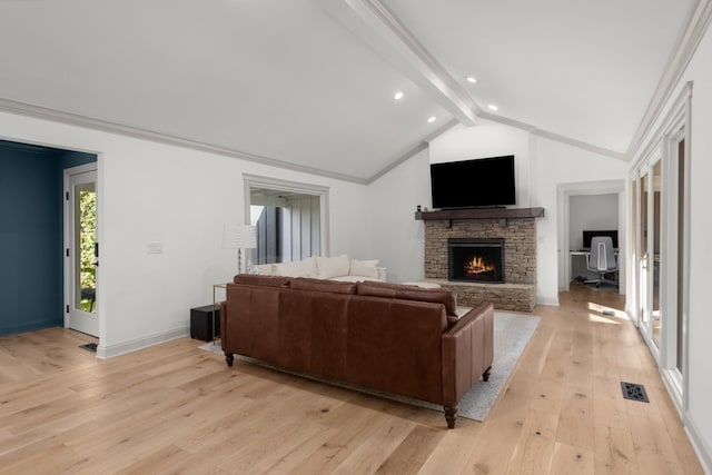 living room with a fireplace, lofted ceiling with beams, ornamental molding, and light hardwood / wood-style flooring