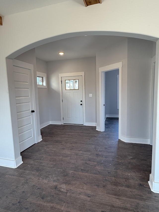 entryway with dark hardwood / wood-style flooring