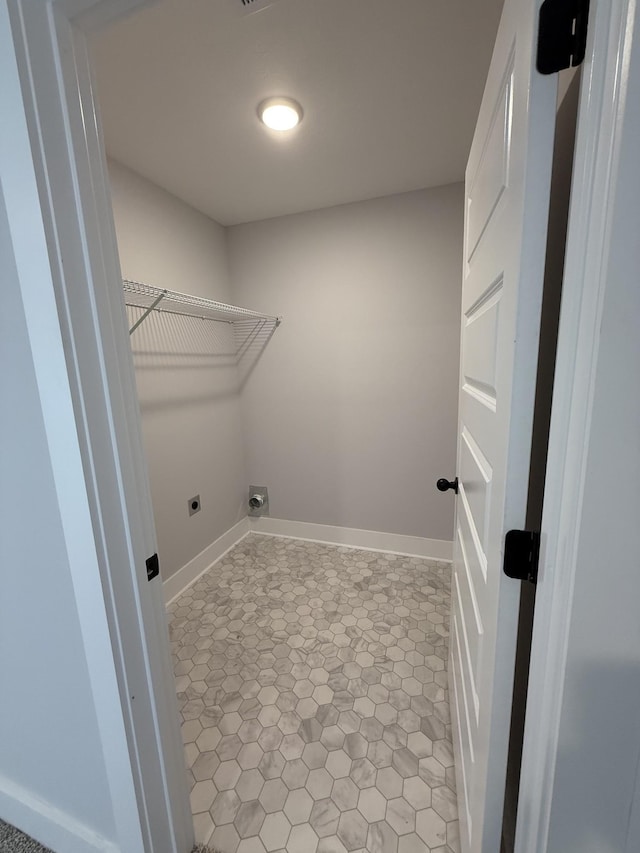 washroom with hookup for an electric dryer