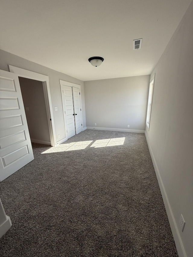 unfurnished bedroom with carpet