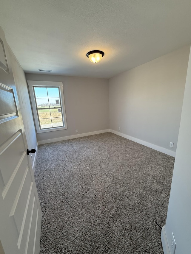 empty room featuring carpet flooring